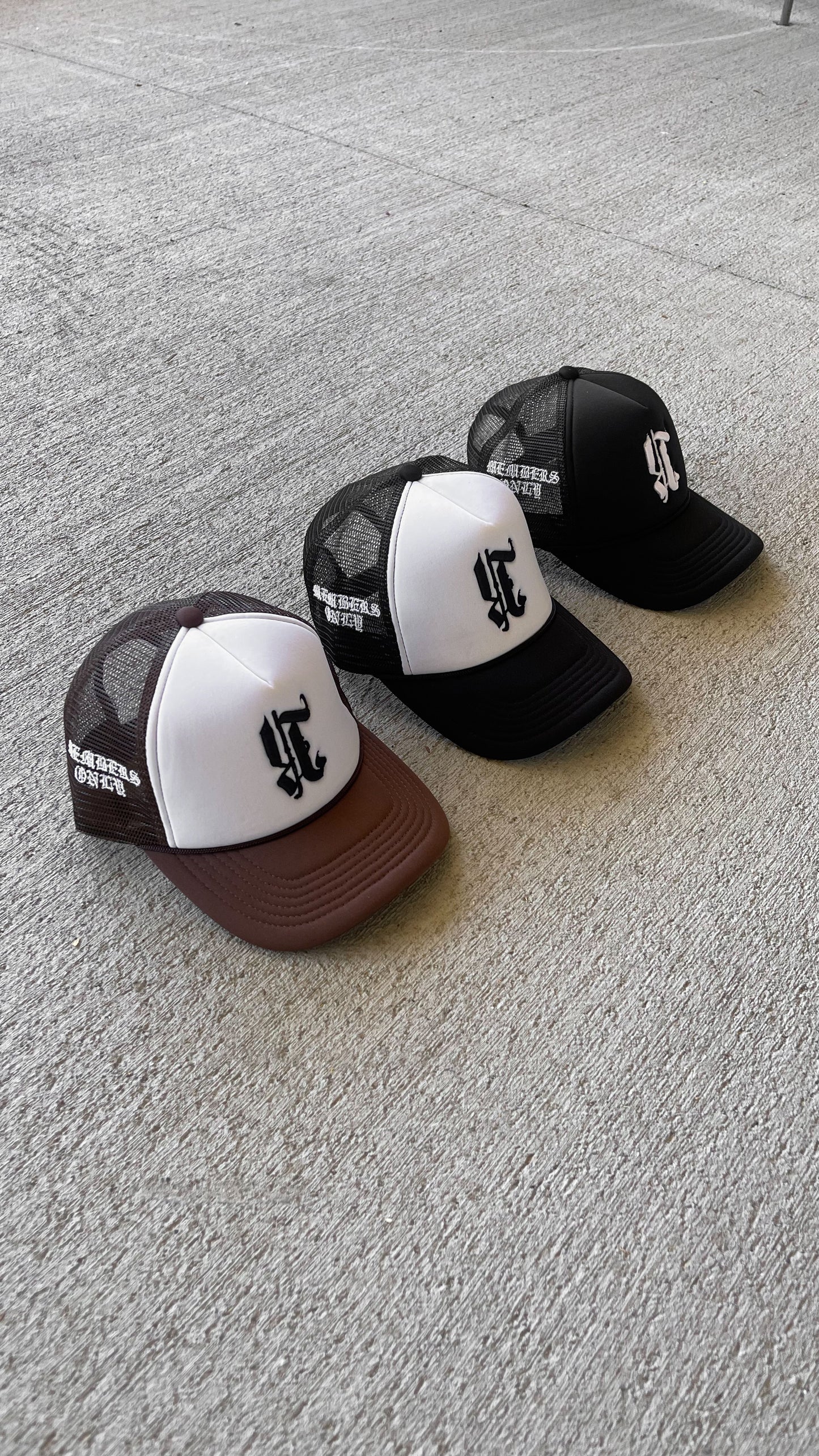 REBELETICS REVERSED "R" TRUCKER HAT - BLACK/WHITE